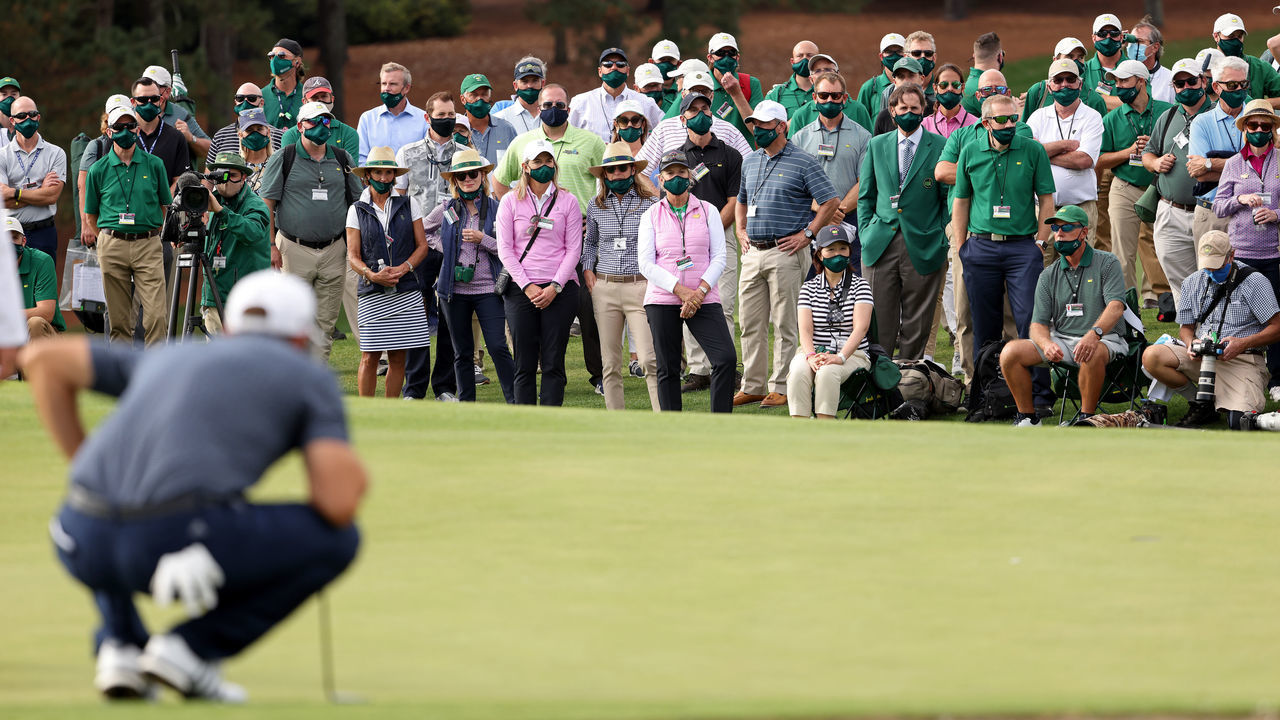 AUGUSTA, GEORGIA - NOVEMBER 15: A view of the gallery as Dustin Johnson of the United States lines up a putt on the 18th green during the final round of the Masters at Augusta National Golf Club on November 15, 2020 in Augusta, Georgia.