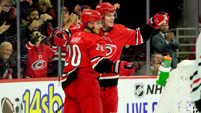 RALEIGH, NC - OCTOBER 26: Andrei Svechnikov #37 of the Carolina Hurricanes scores a goal and celebrates with teammate Sebastian Aho #20 an NHL game against the Chicago Blackhawks on October 26, 2019 at PNC Arena in Raleigh North Carolina.