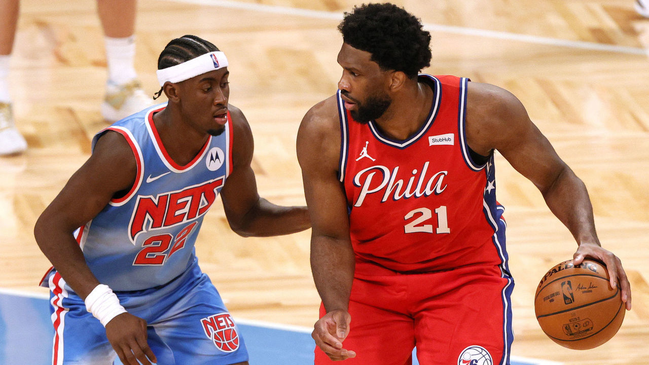 NEW YORK, NEW YORK - JANUARY 07: Joel Embiid #21 of the Philadelphia 76ers dribbles against Caris LeVert #22 of the Brooklyn Nets during the second half at Barclays Center on January 07, 2021 in the Brooklyn borough of New York City.