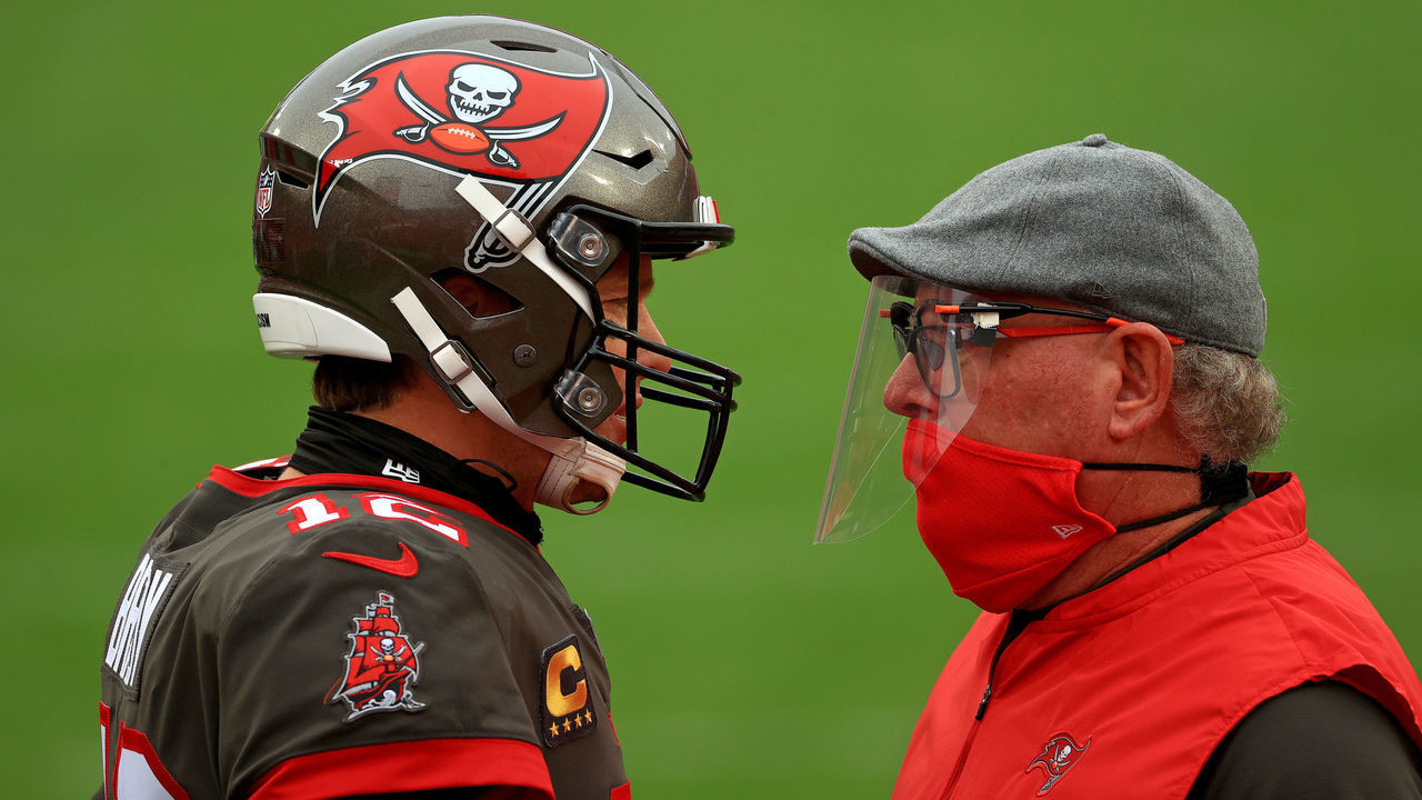 TAMPA, FLORIDA - JANUARY 03: Tom Brady #12 of the Tampa Bay Buccaneers talks with head coach Bruce Arians of the Tampa Bay Buccaneers before a game against the Atlanta Falcons at Raymond James Stadium on January 03, 2021 in Tampa, Florida.