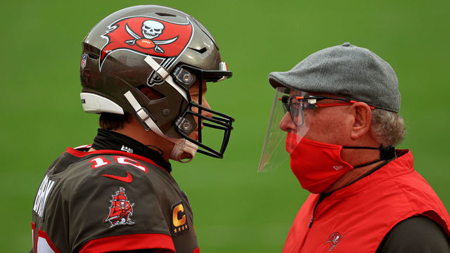 TAMPA, FLORIDA - JANUARY 03: Tom Brady #12 of the Tampa Bay Buccaneers talks with head coach Bruce Arians of the Tampa Bay Buccaneers before a game against the Atlanta Falcons at Raymond James Stadium on January 03, 2021 in Tampa, Florida.