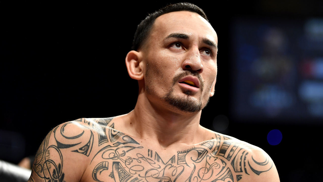 LAS VEGAS, NEVADA - DECEMBER 14: Max Holloway enters the octagon during the UFC 245 event at T-Mobile Arena on December 14, 2019 in Las Vegas, Nevada.