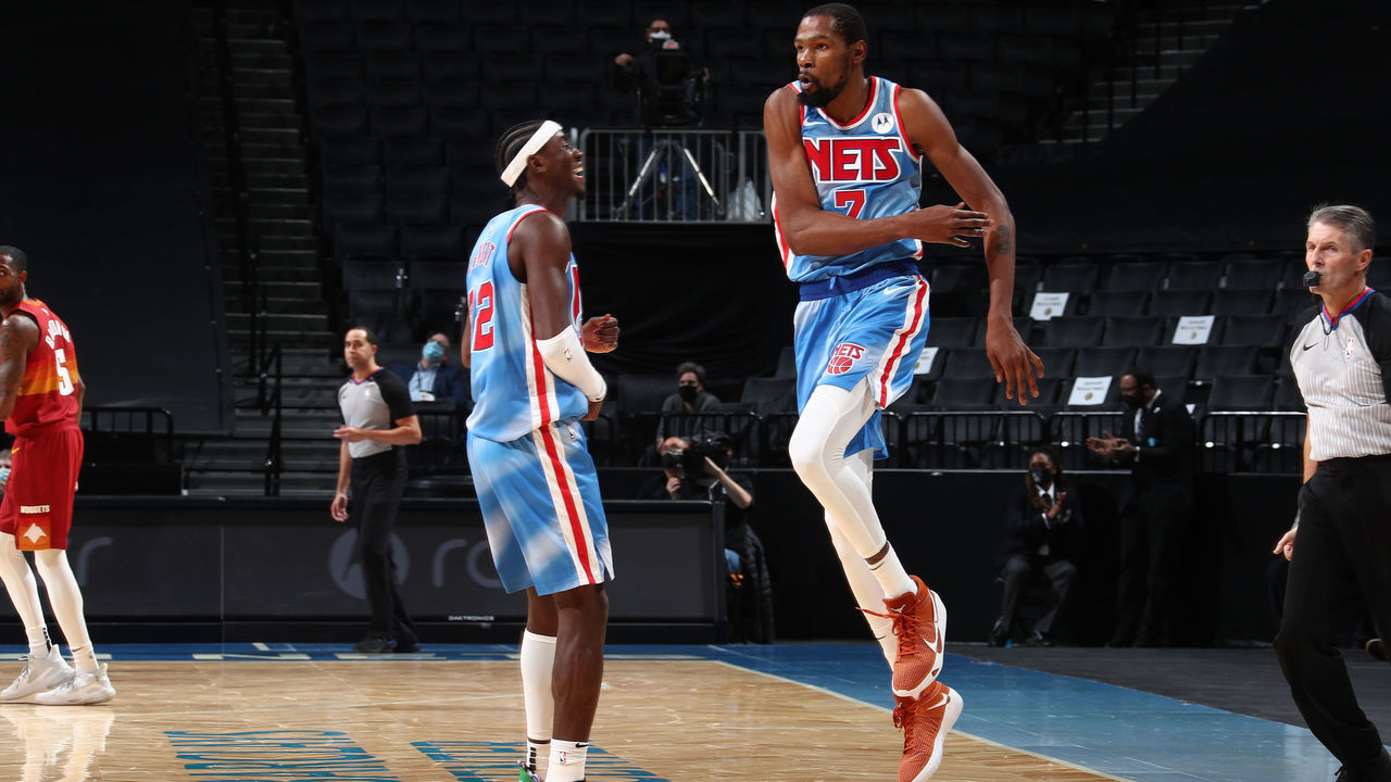 BROOKLYN, NY - JANUARY 12: Kevin Durant #7 and Caris LeVert #22 of the Brooklyn Nets celebrate during the game against the Denver Nuggets on January 12, 2021 at Barclays Center in Brooklyn, New York. Mandatory Copyright Notice: Copyright 2021 NBAE