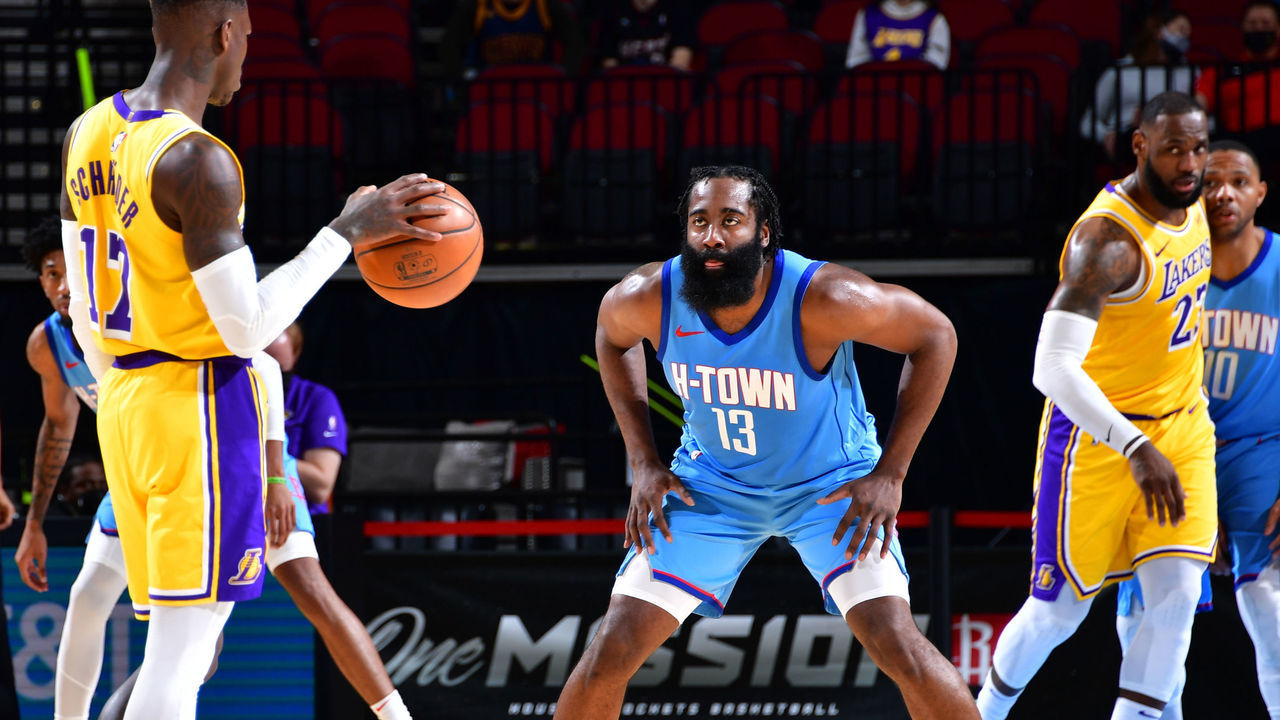 HOUSTON, TX - JANUARY 12: Dennis Schroder #17 of the Los Angeles Lakers dribbles the ball while James Harden #13 of the Houston Rockets plays defense during the game on January 12, 2021 at the Toyota Center in Houston, Texas. Mandatory Copyright Notice: Copyright 2021 NBAE