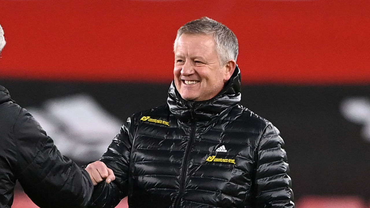 Newcastle United's English head coach Steve Bruce (L) and Sheffield United's English manager Chris Wilder (R) talk on the pitch ahead of the English Premier League football match between Sheffield United and Newcastle United at Bramall Lane in Sheffield, northern England on January 12, 2021.