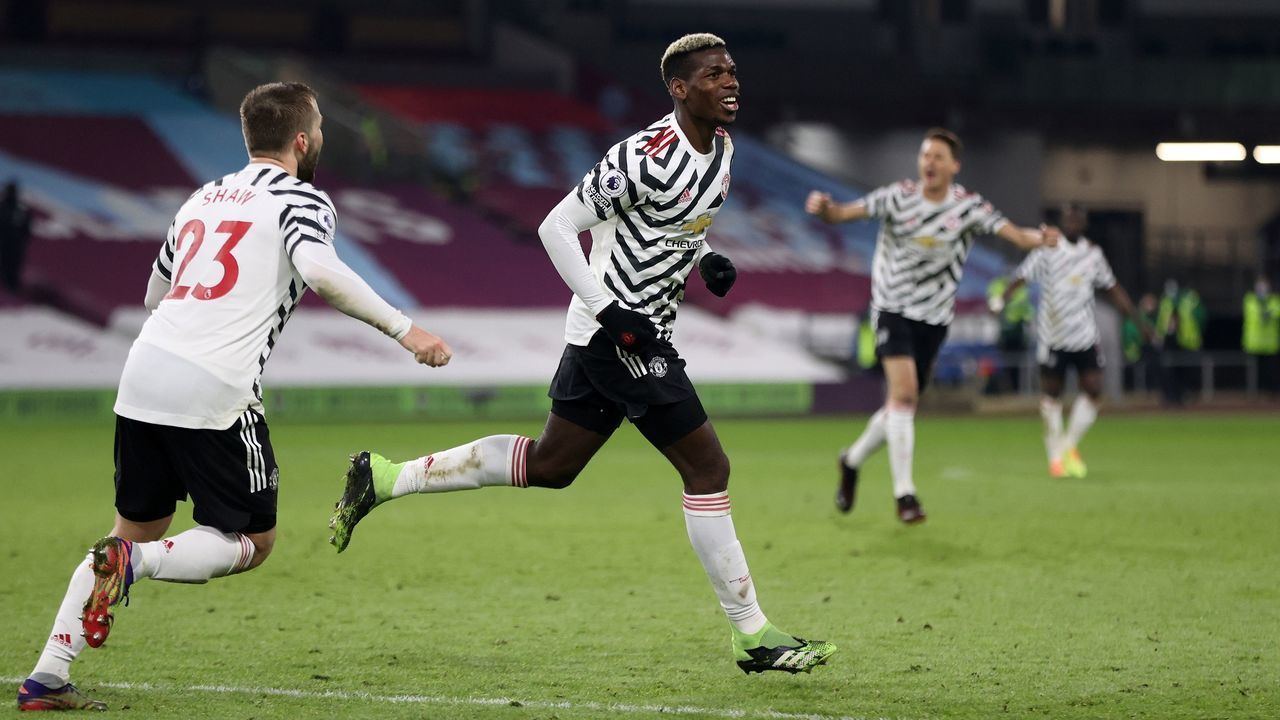 Manchester United's French midfielder Paul Pogba celebrates scoring the opening goal during the English Premier League football match between Burnley and Manchester United at Turf Moor in Burnley, north west England on January 12, 2021.