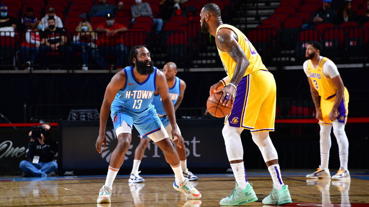 HOUSTON, TX - JANUARY 12: LeBron James #23 of the Los Angeles Lakers dribbles the ball while James Harden #13 of the Houston Rockets plays defense during the game on January 12, 2021 at the Toyota Center in Houston, Texas. Mandatory Copyright Notice: Copyright 2021 NBAE