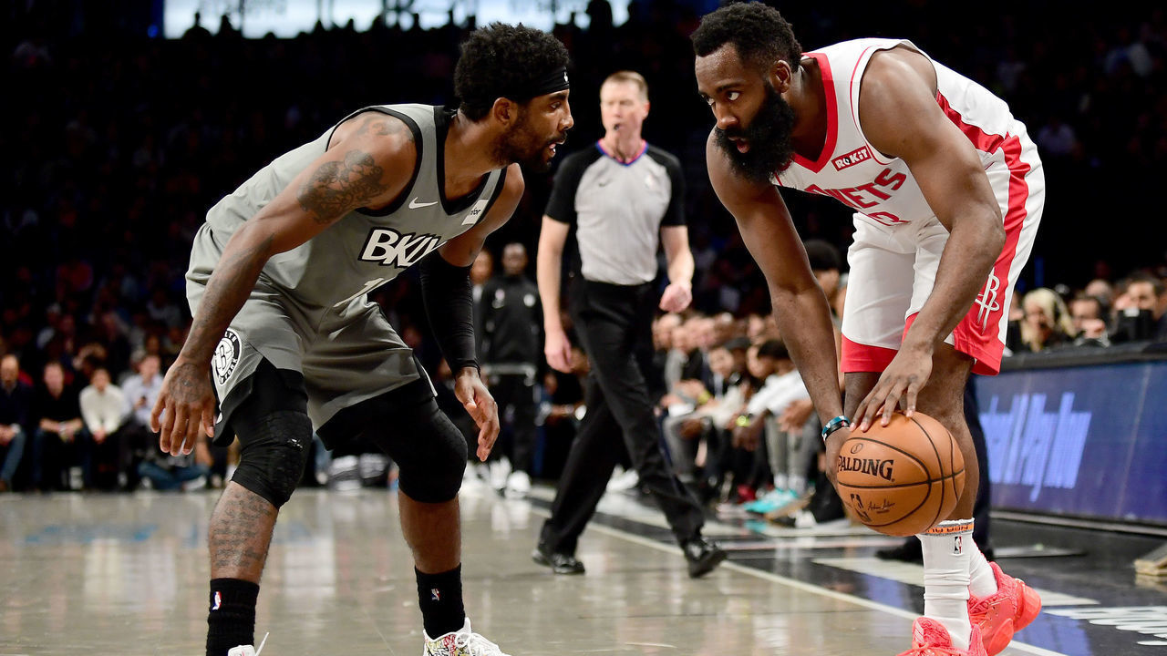 NEW YORK, NEW YORK - NOVEMBER 01: James Harden #13 of the Houston Rockets looks to drive past Kyrie Irving #11 of the Brooklyn Nets during the first half of their game at Barclays Center on November 01, 2019 in the Brooklyn borough New York City.