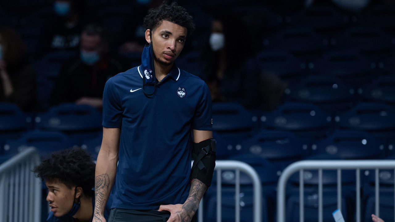 INDIANAPOLIS, IN - JANUARY 09: Injured UConn Huskies guard James Bouknight (2) on the sidelines during the men's college basketball game between the UConn Huskies and Butler Bulldogs on January 9, 2021, at Hinkle Fieldhouse in Indianapolis, IN.
