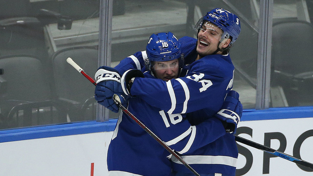 Toronto, ON- January 9 - Mitch Marner celebrates after a goal by Auston Matthews in third period action as the Toronto Maple Leafs hold their annual Blue versus White intersquad game at ScotiaBank Arena in Toronto. January 9, 2021. The game is played before an empty arena as Ontario faces stricter restrictions to slow the spread of the COVID-19 pandemic (Steve Russell/Toronto Star via Getty Images)