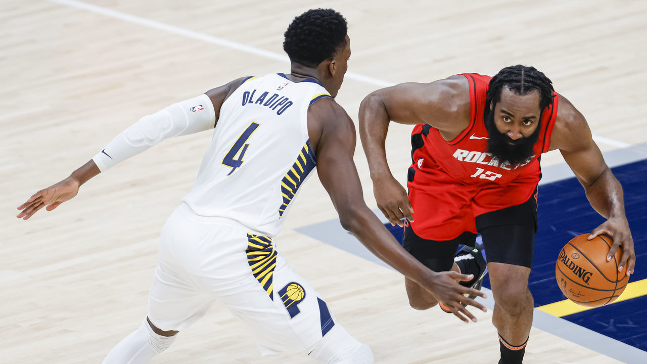 INDIANAPOLIS, IN - JANUARY 06: James Harden #13 of the Houston Rockets dribbles the ball against Victor Oladipo #4 of the Indiana Pacers during the game at Bankers Life Fieldhouse on January 6, 2021 in Indianapolis, Indiana.