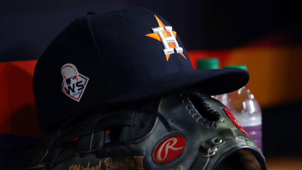 HOUSTON, TX - OCTOBER 23: A detail shot of the cap and glove of Michael Brantley #23 of the Houston Astros in the dugout during Game 2 of the 2019 World Series between the Washington Nationals and the Houston Astros at Minute Maid Park on Wednesday, October 23, 2019 in Houston, Texas.