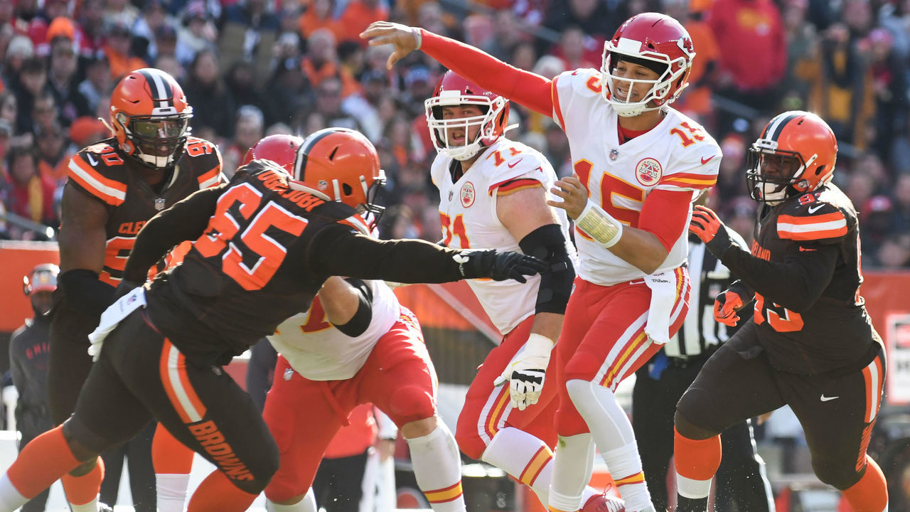 CLEVELAND, OH - NOVEMBER 4, 2018: Quarterback Patrick Mahomes #15 of the Kansas City Chiefs throws a pass as he is pressured by defensive tackle Larry Ogunjobi #65 of the Cleveland Browns in the second quarter of a game on November 4, 2018 at FirstEnergy Stadium in Cleveland, Ohio. Kansas City won 37-21. (Photo by: 2018 Nick Cammett/Diamond Images/Getty Images)