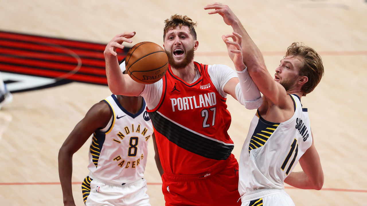 PORTLAND, OREGON - JANUARY 14: Jusuf Nurkic #27 of the Portland Trail Blazers loses control of the ball against Domantas Sabonis #11 of the Indiana Pacers in the third quarter at Moda Center on January 14, 2021 in Portland, Oregon.