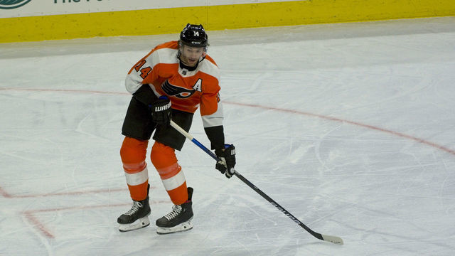 PHILADELPHIA, PA - JANUARY 13: Philadelphia Flyers Center Sean Couturier (14) shoots the puck during the game between the Pittsburg Penquins and the Philadelphia Flyers on January 13, 2021 at Wells Fargo Center in Philadelphia, PA.