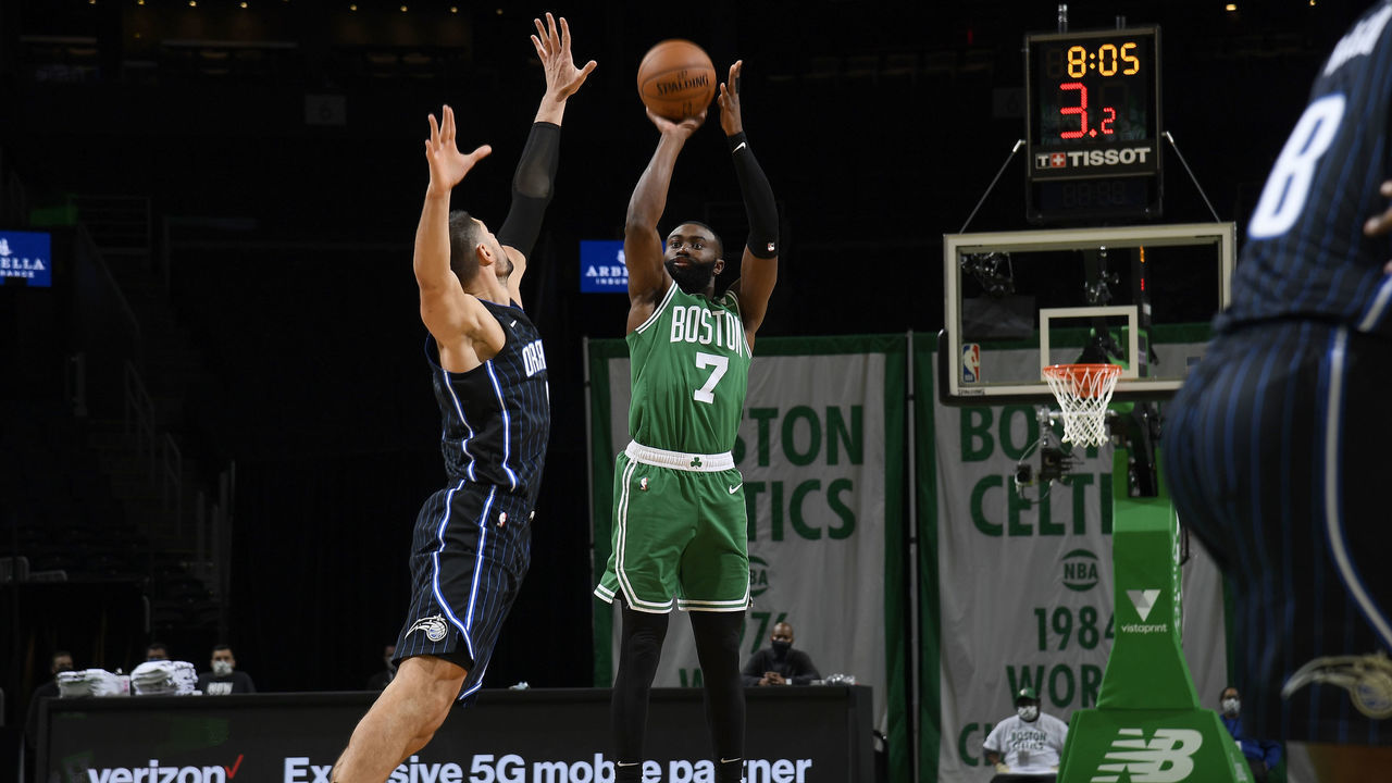 BOSTON, MA - JANUARY 15: Jaylen Brown #7 of the Boston Celtics shoots a three point basket during the game against the Orlando Magic on January 15, 2021 at the TD Garden in Boston, Massachusetts. Mandatory Copyright Notice: Copyright 2021 NBAE