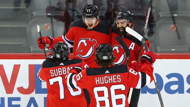 NEWARK, NJ - JANUARY 16: New Jersey Devils forward Yegor Sharangovich (17) celebrates with teammate New Jersey Devils right wing Kyle Palmieri (21), New Jersey Devils defenseman P.K. Subban (76) and New Jersey Devils center Jack Hughes (86) after he scores his first National Hockey League goal during the overtime period of the National Hockey League game between the New Jersey Devils and the Boston Bruins on January16, 2021 at the Prudential Center in Newark, NJ.