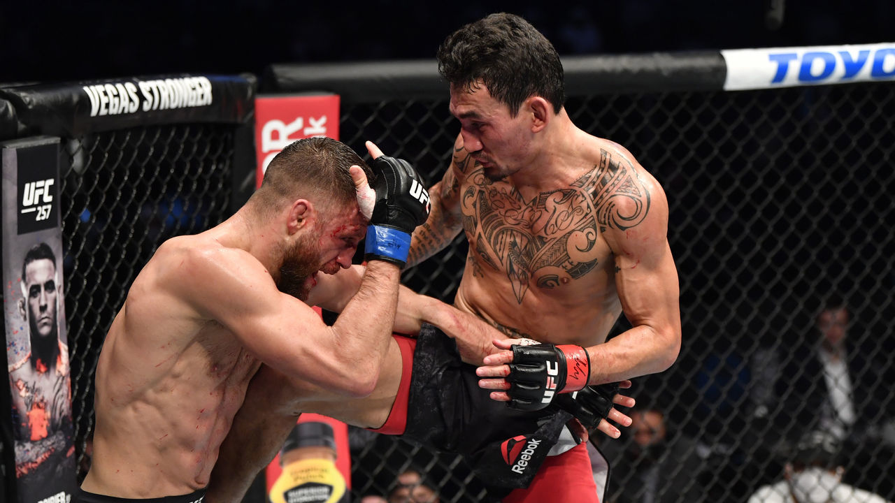 ABU DHABI, UNITED ARAB EMIRATES - JANUARY 17: (L-R) Max Holloway kicks Calvin Kattar in a featherweight bout during the UFC Fight Night event at Etihad Arena on UFC Fight Island on January 17, 2021 in Abu Dhabi, United Arab Emirates.