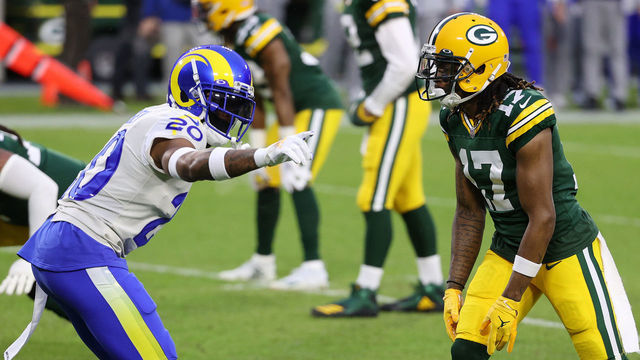 GREEN BAY, WISCONSIN - JANUARY 16: Davante Adams #17 of the Green Bay Packers lines up against Jalen Ramsey #20 of the Los Angeles Rams in the first quarter during the NFC Divisional Playoff game at Lambeau Field on January 16, 2021 in Green Bay, Wisconsin.