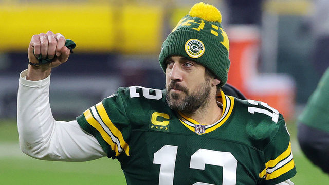 GREEN BAY, WISCONSIN - JANUARY 16: Aaron Rodgers #12 of the Green Bay Packers celebrates defeating the Los Angeles Rams 32-18 in the NFC Divisional Playoff game at Lambeau Field on January 16, 2021 in Green Bay, Wisconsin.