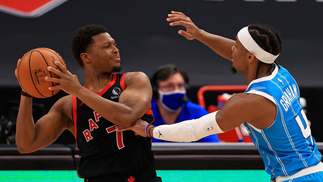 TAMPA, FLORIDA - JANUARY 16: Kyle Lowry #7 of the Toronto Raptors is defended by Devonte' Graham #4 of the Charlotte Hornets during a game at Amalie Arena on January 16, 2021 in Tampa, Florida.