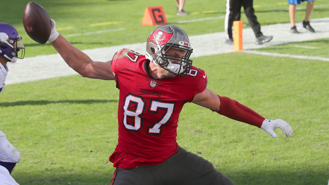 TAMPA, FL - DECEMBER 13: Rob Gronkowski (87) of the Buccaneers scores a touchdown and then does the Gronk Spike in the end zone during the regular season game between the Minnesota Vikings and the Tampa Bay Buccaneers on December 13, 2020 at Raymond James Stadium in Tampa, Florida.