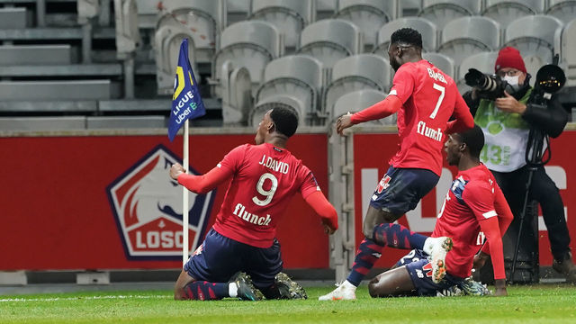 LILLE, FRANCE - JANUARY 17: Jonathan David of Lille OSC celebrates after scoring his teams second goal during the Ligue 1 match between Lille OSC and Stade Reims at Stade Pierre Mauroy on January 17, 2021 in Lille, France.