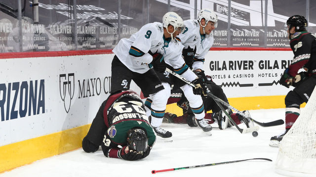 GLENDALE, ARIZONA - JANUARY 16: Oliver Ekman-Larsson #23 of the Arizona Coyotes lays on the ice after taking a stick to the face during the third period of the NHL hockey game against the San Jose Sharks at Gila River Arena on January 16, 2021 in Glendale, Arizona.