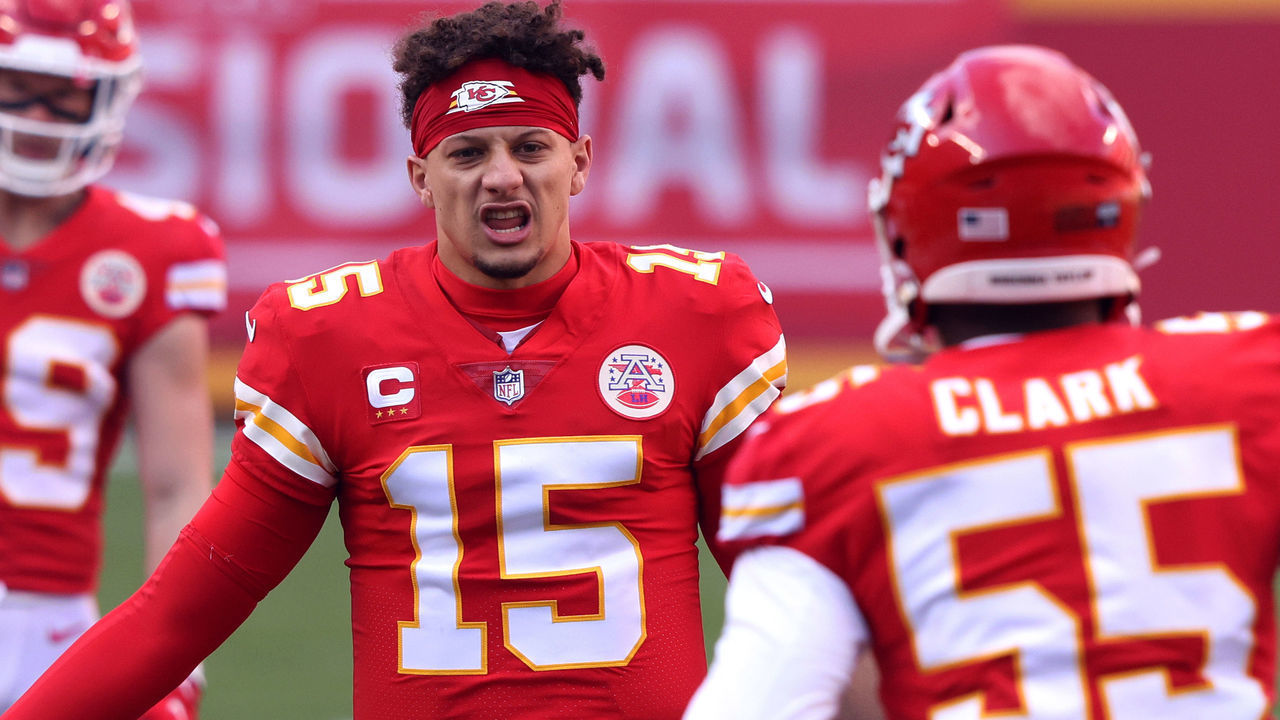 KANSAS CITY, MISSOURI - JANUARY 17: Quarterback Patrick Mahomes #15 of the Kansas City Chiefs welcomes defensive end Frank Clark #55 onto the field to start the AFC Divisional Playoff game against the Cleveland Browns at Arrowhead Stadium on January 17, 2021 in Kansas City, Missouri.