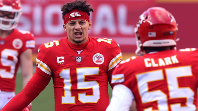 KANSAS CITY, MISSOURI - JANUARY 17: Quarterback Patrick Mahomes #15 of the Kansas City Chiefs welcomes defensive end Frank Clark #55 onto the field to start the AFC Divisional Playoff game against the Cleveland Browns at Arrowhead Stadium on January 17, 2021 in Kansas City, Missouri.