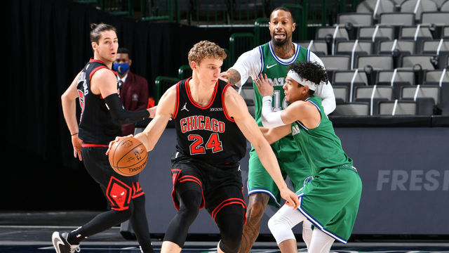 DALLAS, TX - JANUARY 17: Lauri Markkanen #24 of the Chicago Bulls handles the ball during the game against the Dallas Mavericks on January 17, 2021 at the American Airlines Center in Dallas, Texas. Mandatory Copyright Notice: Copyright 2021 NBAE