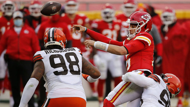 KANSAS CITY, MISSOURI - JANUARY 17: Quarterback Patrick Mahomes #15 of the Kansas City Chiefs is sacked by defensive end Myles Garrett #95 of the Cleveland Browns during the third quarter of the AFC Divisional Playoff game at Arrowhead Stadium on January 17, 2021 in Kansas City, Missouri.