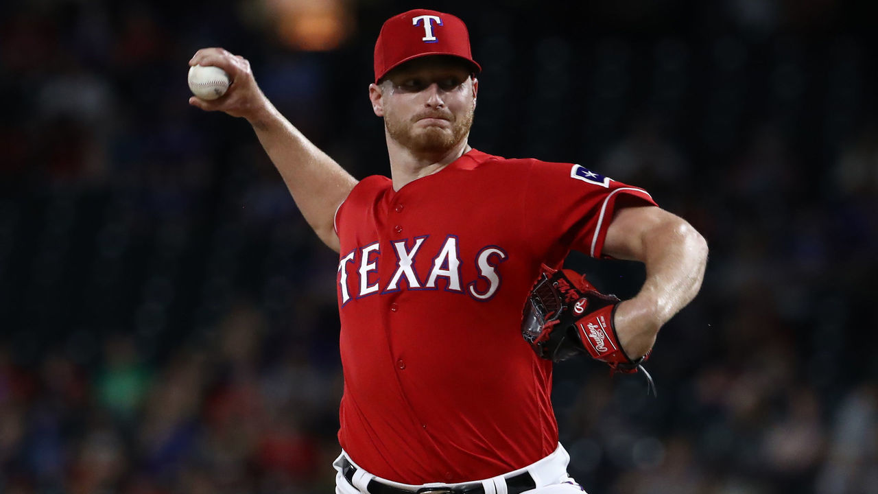 ARLINGTON, TEXAS - JUNE 19: Shelby Miller #19 of the Texas Rangers throws against the Cleveland Indians in the eighth inning at Globe Life Park in Arlington on June 19, 2019 in Arlington, Texas.