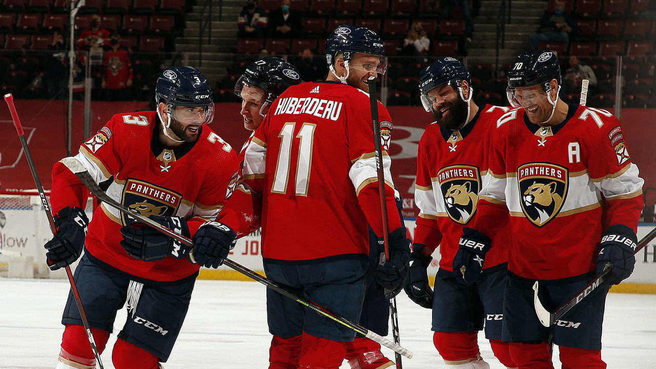 SUNRISE, FL - JANUARY 17: Keith Yandle #3 of the Florida Panthers celebrates his goal with teammates during the second period against the Chicago Blackhawks at the BB&T Center on January17, 2021 in Sunrise, Florida.