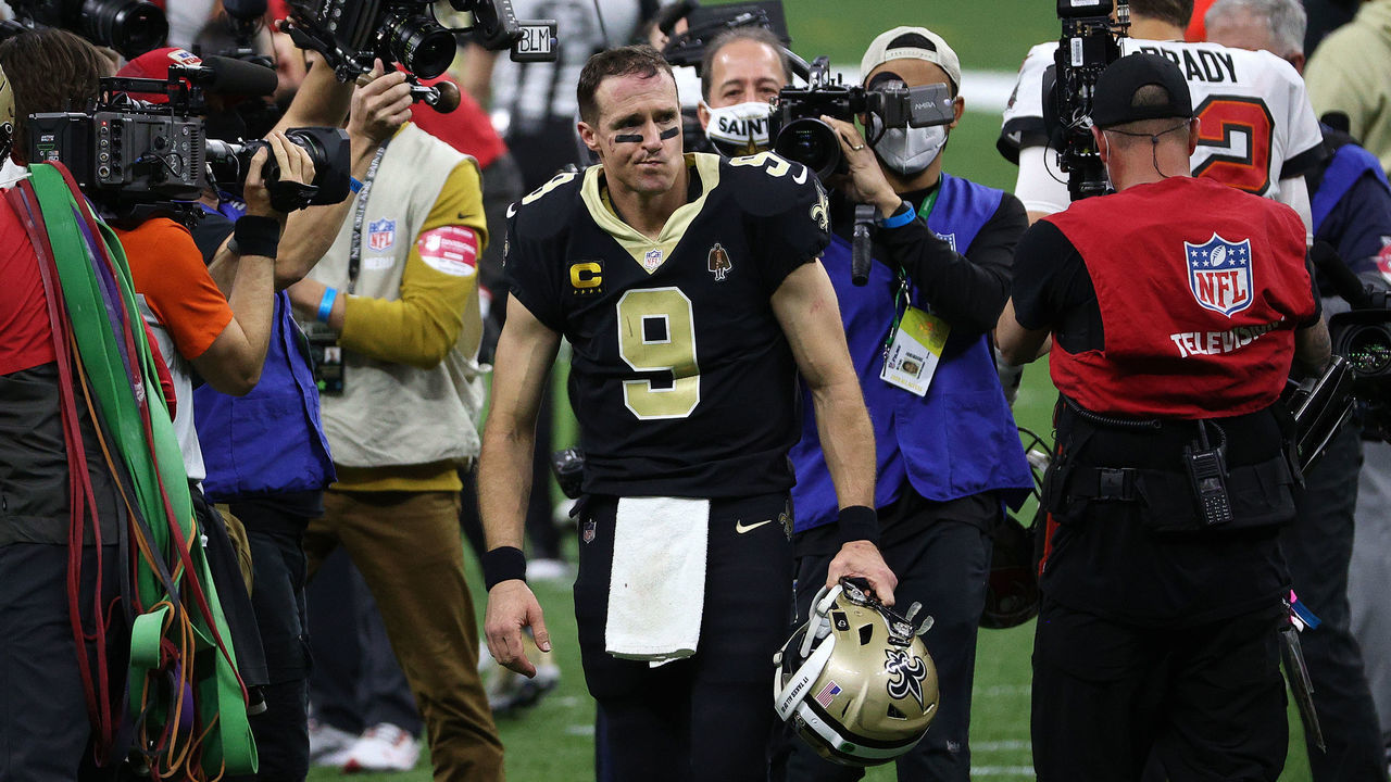 NEW ORLEANS, LOUISIANA - JANUARY 17: Drew Brees #9 of the New Orleans Saints walks off the field after being defeated by the Tampa Bay Buccaneers in the NFC Divisional Playoff game at Mercedes Benz Superdome on January 17, 2021 in New Orleans, Louisiana.