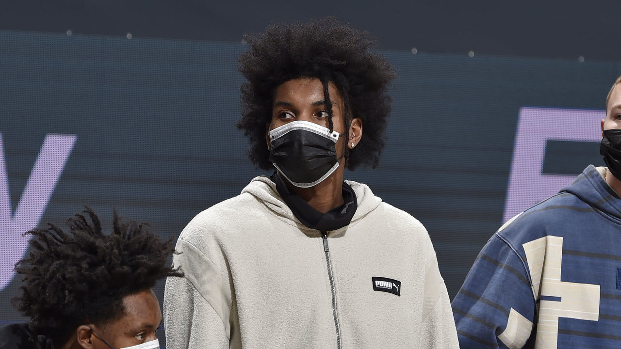 CLEVELAND, OH - JANUARY 15: Collin Sexton #2, Kevin Porter Jr. #4 and Dylan Windler #9 of the Cleveland Cavaliers look on during the game against the New York Knicks on January 15, 2021 at Rocket Mortgage FieldHouse in Cleveland, Ohio. NOTE TO USER: User expressly acknowledges and agrees that, by downloading and/or using this Photograph, user is consenting to the terms and conditions of the Getty Images License Agreement. Mandatory Copyright Notice: Copyright 2021 NBAE