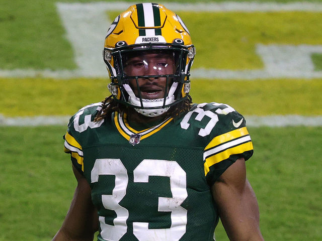 Download Green Bay Packers #33 Aaron Jones runs for a touchdown Wallpaper