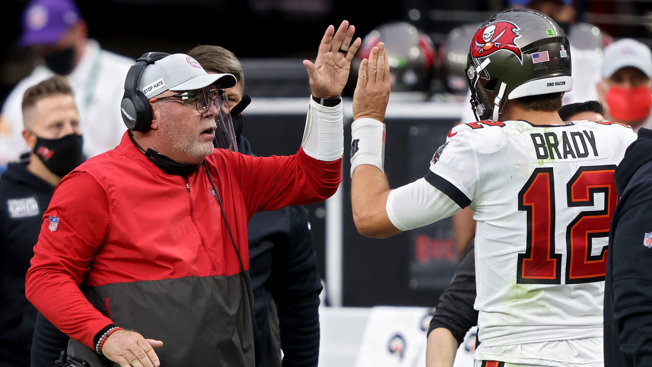 LAS VEGAS, NEVADA - OCTOBER 25: Head coach Bruce Arians and Tom Brady #12 of the Tampa Bay Buccaneers celebrate after scoring a touchdown in the second quarter against the Las Vegas Raiders at Allegiant Stadium on October 25, 2020 in Las Vegas, Nevada.