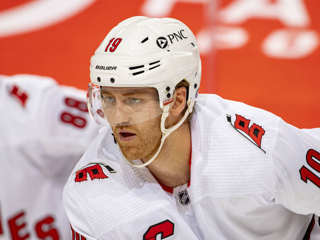 DETROIT, MI - JANUARY 14: Dougie Hamilton #19 of the Carolina Hurricanes lines up for a face-off during an NHL game against the Detroit Red Wings at Little Caesars Arena on January 14, 2021 in Detroit, Michigan.