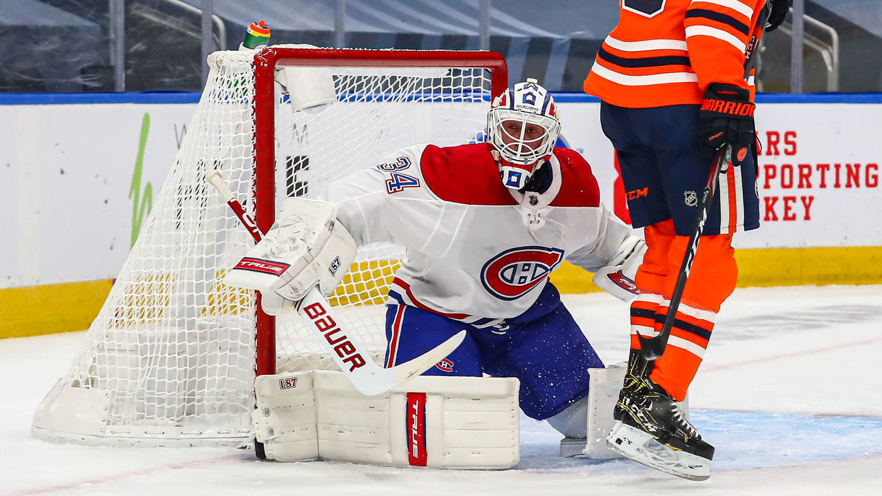EDMONTON, AB - JANUARY 18: Montreal Canadiens Goalie Jake Allen (34) makes a blocker save in the first period during the Edmonton Oilers game versus the Montreal Canadians on January 18, 2021 at Rogers Place in Edmonton, AB.