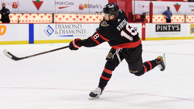 OTTAWA, ON - JANUARY 16: Ottawa Senators Left Wing Tim Stuetzle (18) shoots the puck during the pre-game warm up before the NHL game between the Ottawa Senators and the Toronto Maple Leafs on January 16, 2021 at the Canadian Tire Centre in Ottawa, Ontario, Canada.