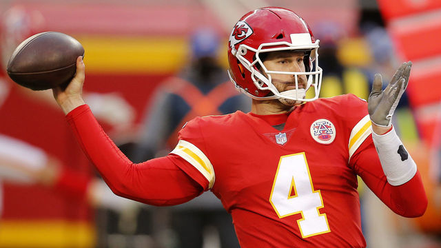 KANSAS CITY, MISSOURI - JANUARY 17: Quarterback Chad Henne #4 of the Kansas City Chiefs delivers a pass over the defense of the Cleveland Browns during the fourth quarter at Arrowhead Stadium on January 17, 2021 in Kansas City, Missouri.