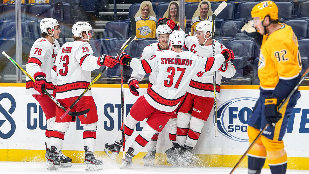 NASHVILLE, TN - JANUARY 18: Sebastian Aho #20 celebrates his goal with Andrei Svechnikov #37 of the Carolina Hurricanes against the Nashville Predators during the third period at Bridgestone Arena on January 18, 2021 in Nashville, Tennessee.