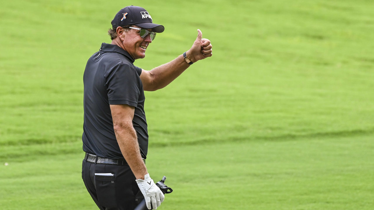 MEMPHIS, TN - AUGUST 02: Phil Mickelson smiles and gives a thumbs up to fans while holding his Coffee For Wellness on the first hole during the final round of the World Golf Championships-FedEx St. Jude Invitational at TPC Southwind on August 2, 2020 in Memphis, Tennessee.