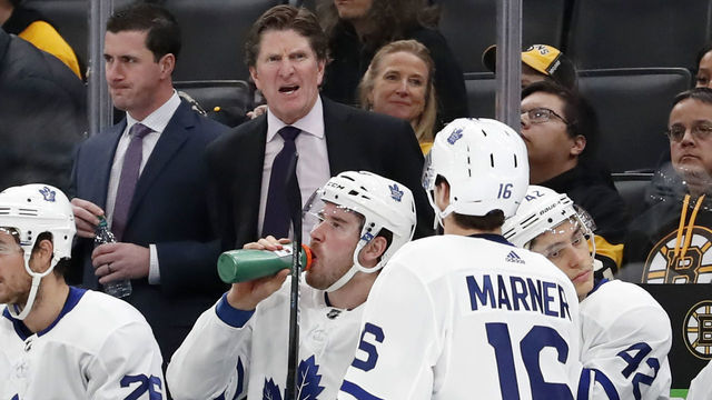 BOSTON, MA - OCTOBER 22: Toronto Maple Leafs head coach Mike Babcock talks to Toronto Maple Leafs right wing Mitchell Marner (16) during a game between the Boston Bruins and the Toronto Maple Leafs on October 22, 2019, at TD Garden in Boston, Massachusetts.