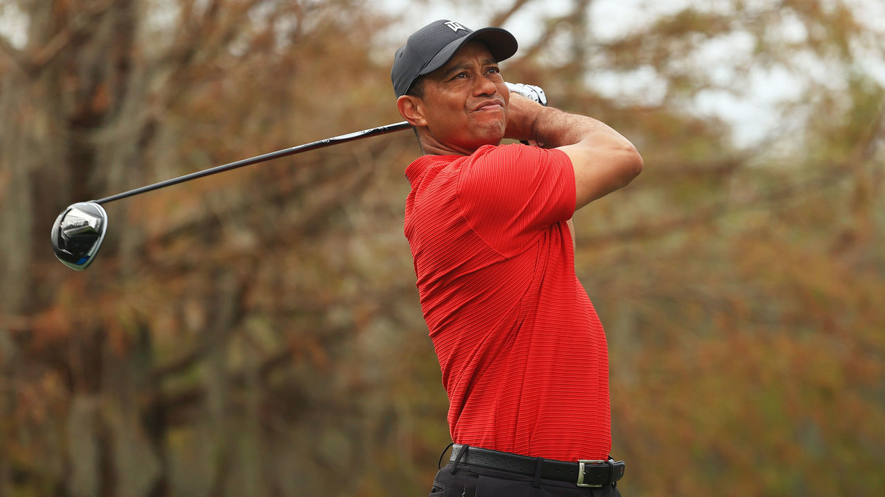 ORLANDO, FLORIDA - DECEMBER 20: Tiger Woods of the United States plays his shot from the ninth tee during the final round of the PNC Championship at the Ritz-Carlton Golf Club Orlando on December 20, 2020 in Orlando, Florida.