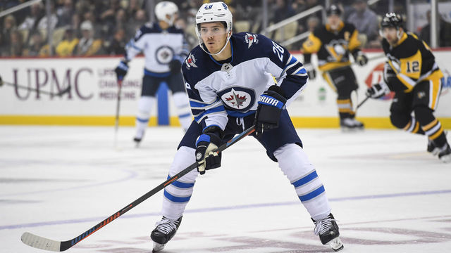 PITTSBURGH, PA - OCTOBER 08: Winnipeg Jets Center Jack Roslovic (28) forechecks during the first period in the NHL game between the Pittsburgh Penguins and the Winnipeg Jets on October 8, 2019, at PPG Paints Arena in Pittsburgh, PA.