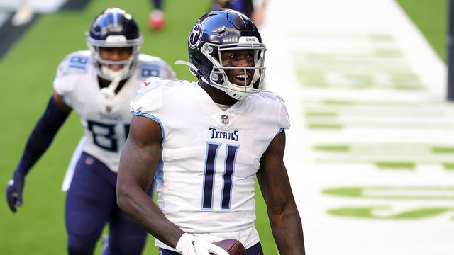 HOUSTON, TEXAS - JANUARY 03: A.J. Brown #11 of the Tennessee Titans celebrates a touchdown during the first half against the Houston Texans at NRG Stadium on January 03, 2021 in Houston, Texas.