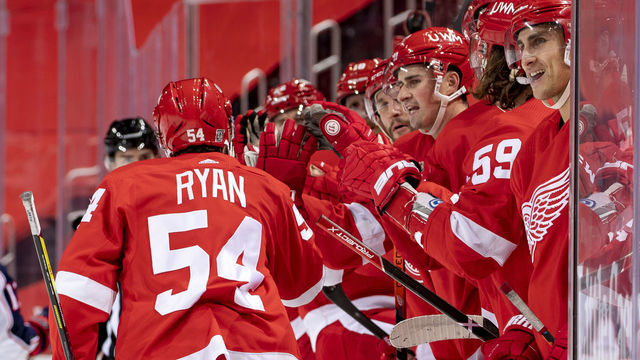DETROIT, MI - JANUARY 19: Bobby Ryan #54 of the Detroit Red Wings taps gloves with teammates on the bench after scoring a goal during the second period of an NHL game against the Columbus Blue Jackets at Little Caesars Arena on January 19, 2021 in Detroit, Michigan.