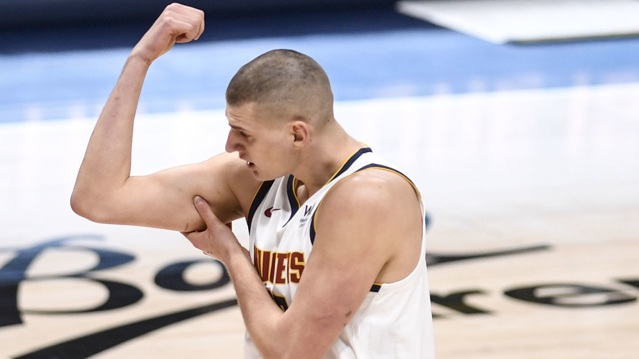 DENVER, CO - JANUARY 19: Nikola Jokic (15) of the Denver Nuggets checks his arm for damage after taking contact against the Denver Nuggets during the first quarter at Ball Arena on Tuesday, January 19, 2021.